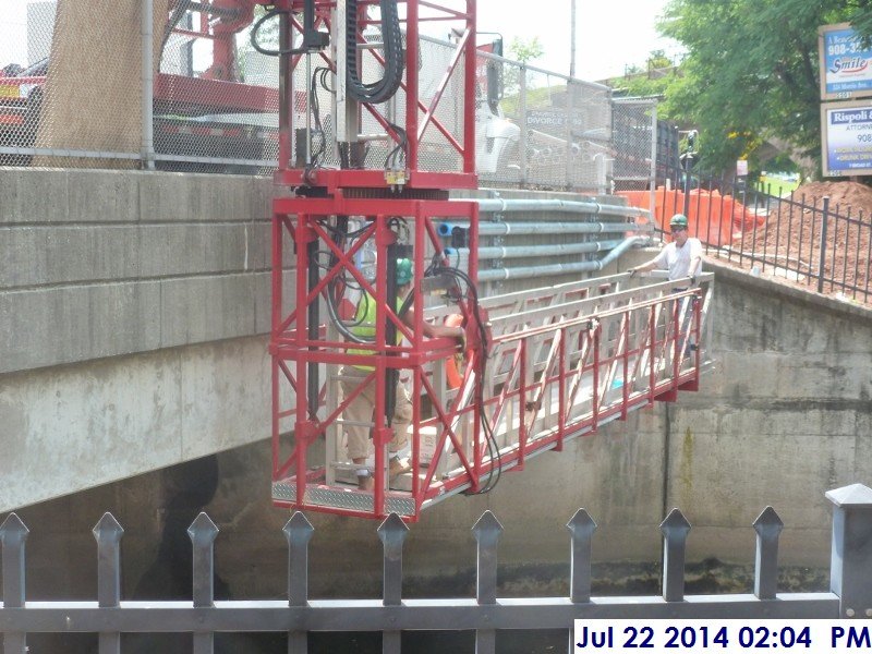 Installing conduit at the bridge by the Administration Building (800x600)